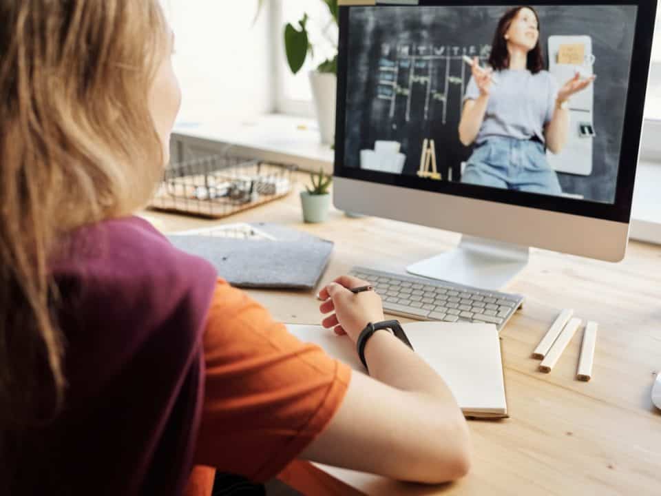 Women sitting in front of a monitor